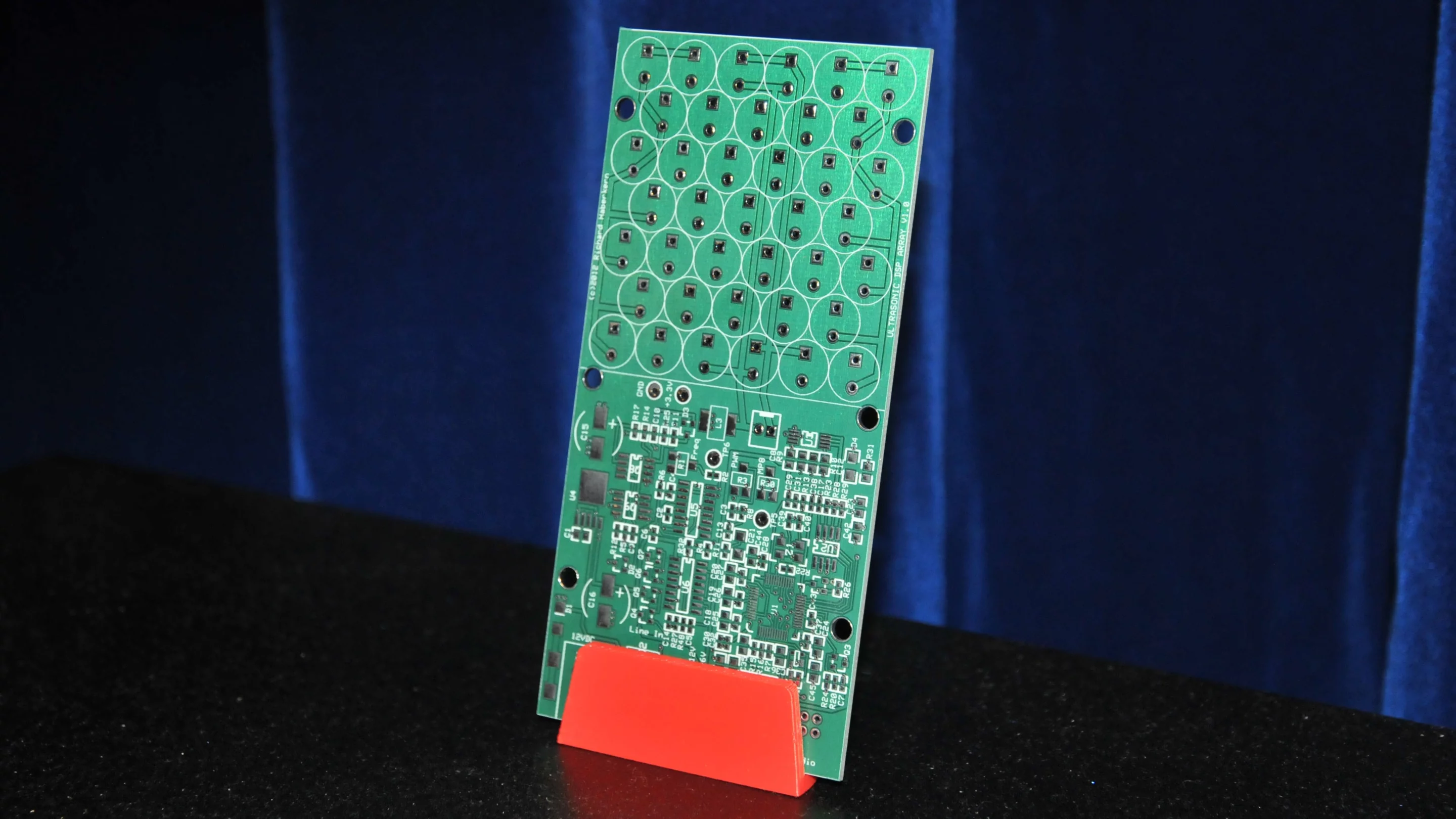 Soundlazer's PCB on a stand awaiting surface mounted components and the piezo ultrasonic transducers