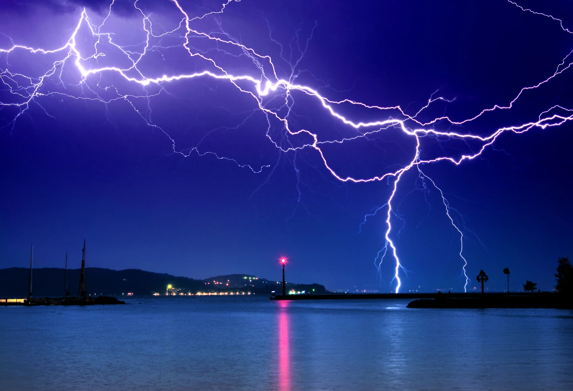 A new study has demonstrated how a tractor beam containing trapped graphene microparticles could one day redirect lightning strikes