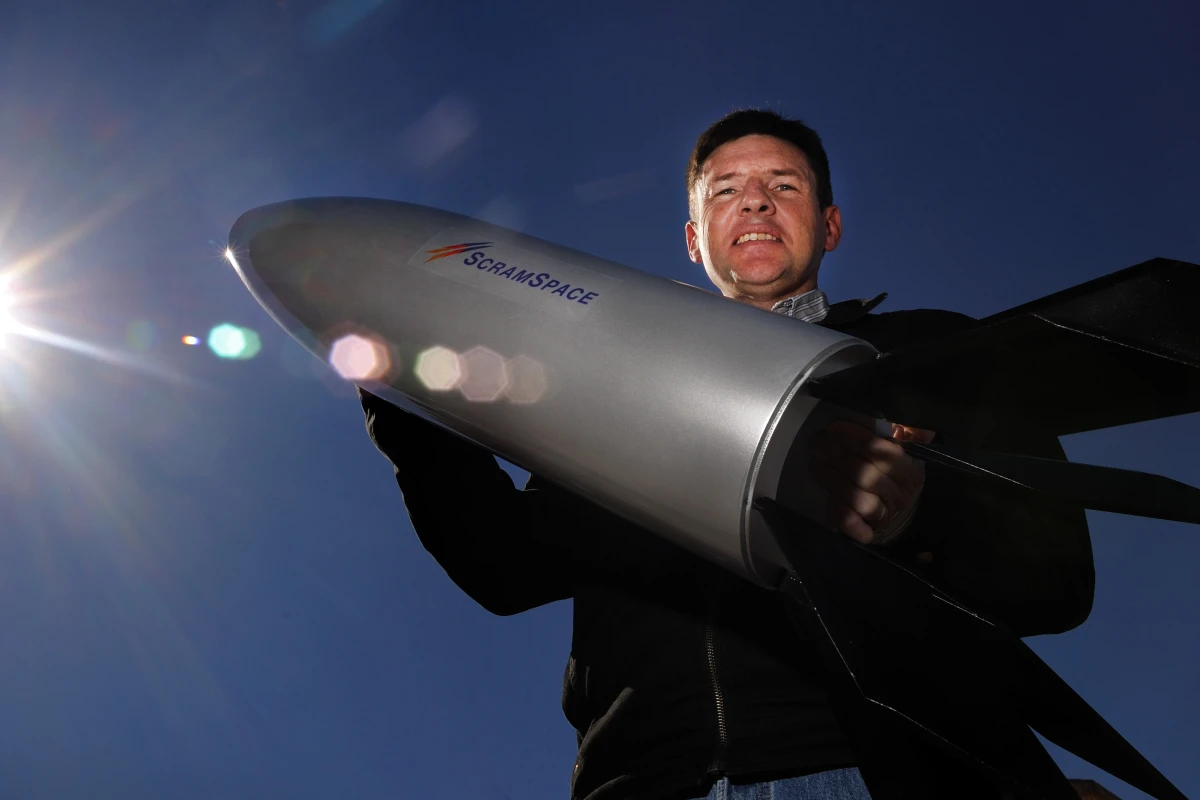 Professor Russell Boyce with a scale model of Scramspace
