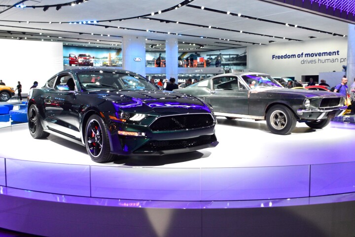 The 1968 Ford Mustang GT 390 from the movie Bullitt next to Ford's new Mustang Bullitt