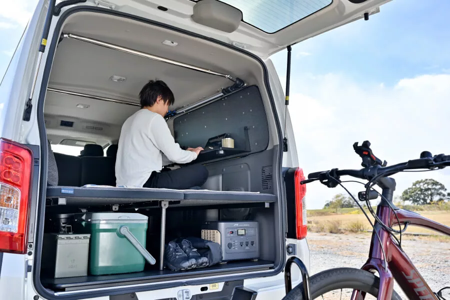 After a morning bike ride, the fold-down side shelf becomes a mobile workstation