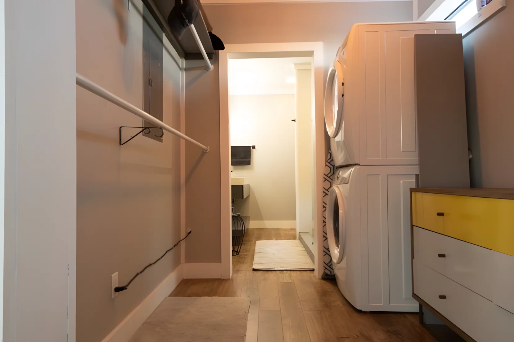 The Modern Side Stack features a laundry area with stacked washing machine and dryer