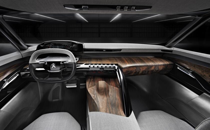 The Peugeot's interior uses a rich blend of materials