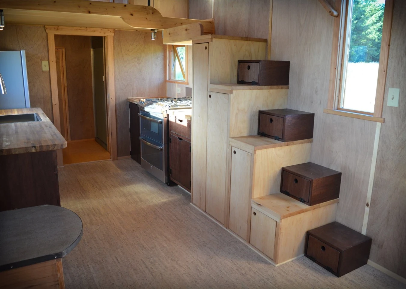 Storage-integrated stairs lead to the bedroom