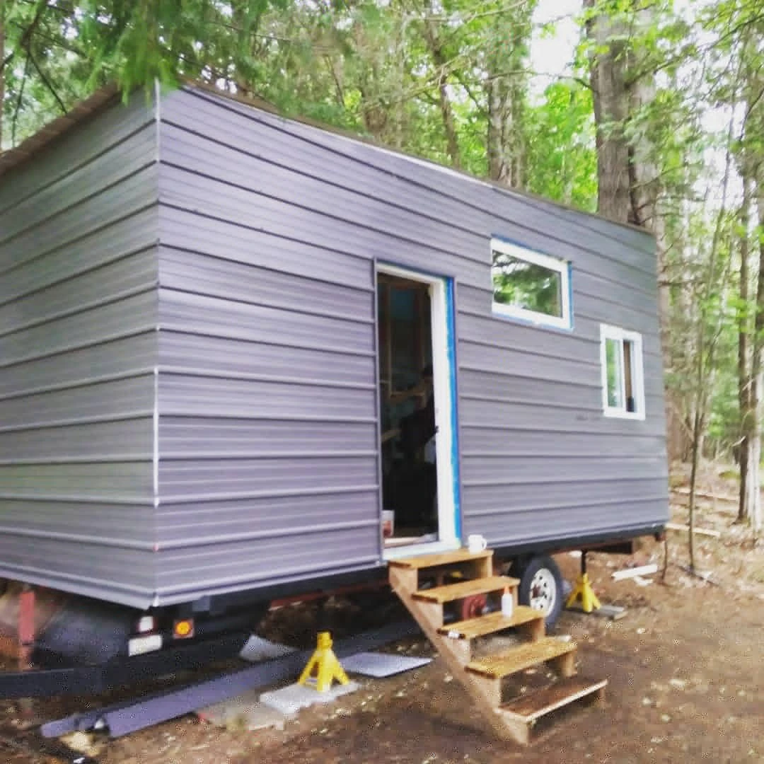 The 140-sq-ft (13-sqm) tiny house is clad with lightweight sheet metal