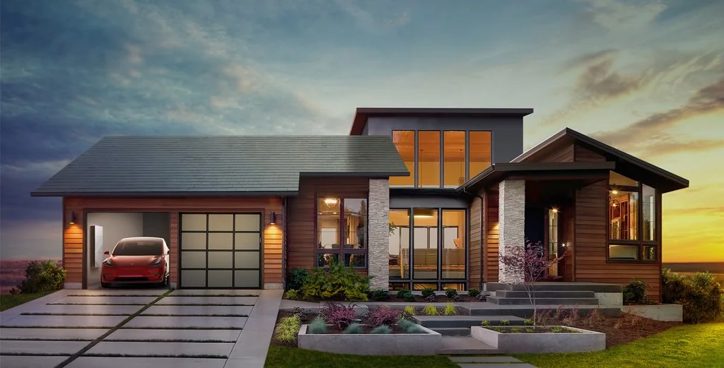 Tesla envisions a house with solar roof tiles and a powerwall and electric vehicle in the garage