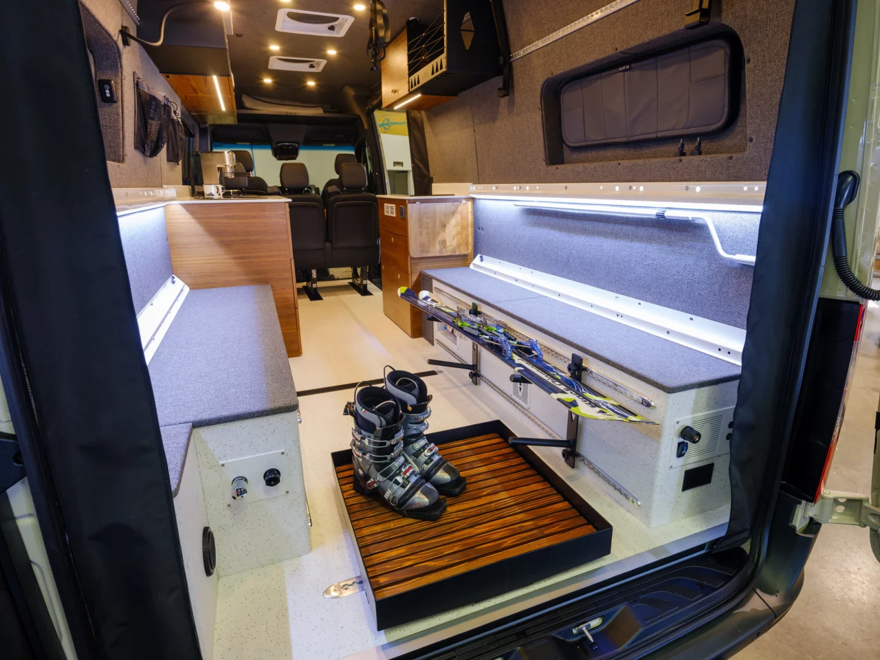 The shower pan doubles as a rack for wet boots or accessories