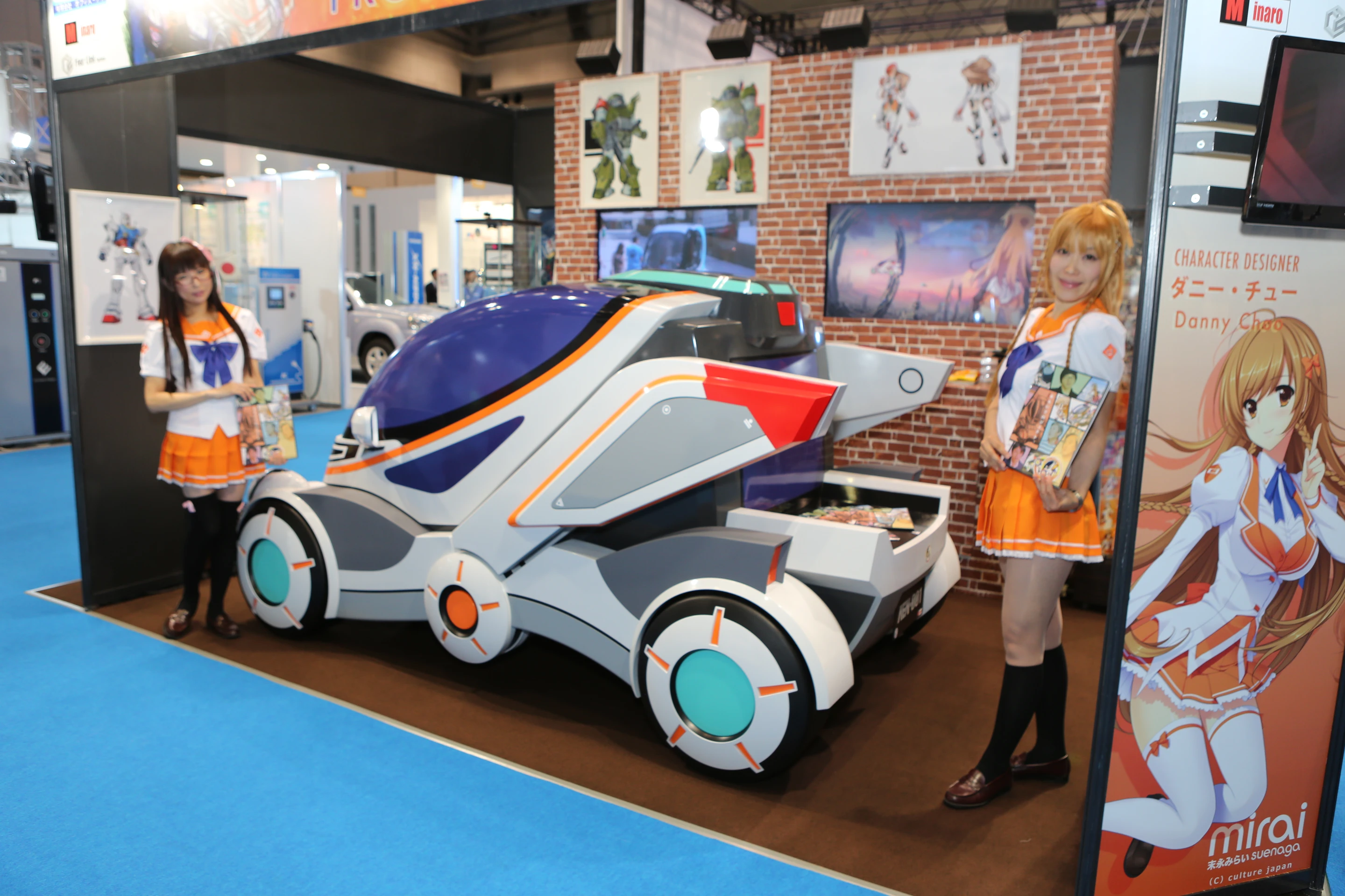 Girls dressed as Mirai Suenaga outfits at the Mirai Project booth (Photo: Mike Hanlon / Gizmag.com)