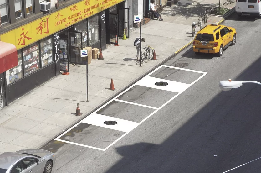 Charging an electric vehicle on the street could be as easy as finding a HEVO charging station, which look like manhole covers