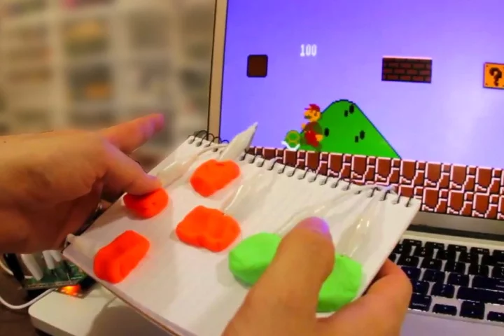 A game controller made from paper and Play-Doh