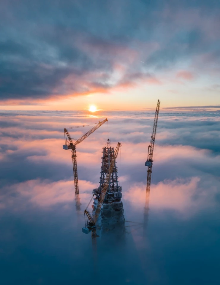 Sun rises over a skyscraper under construction in Saint Petersburg, Russia