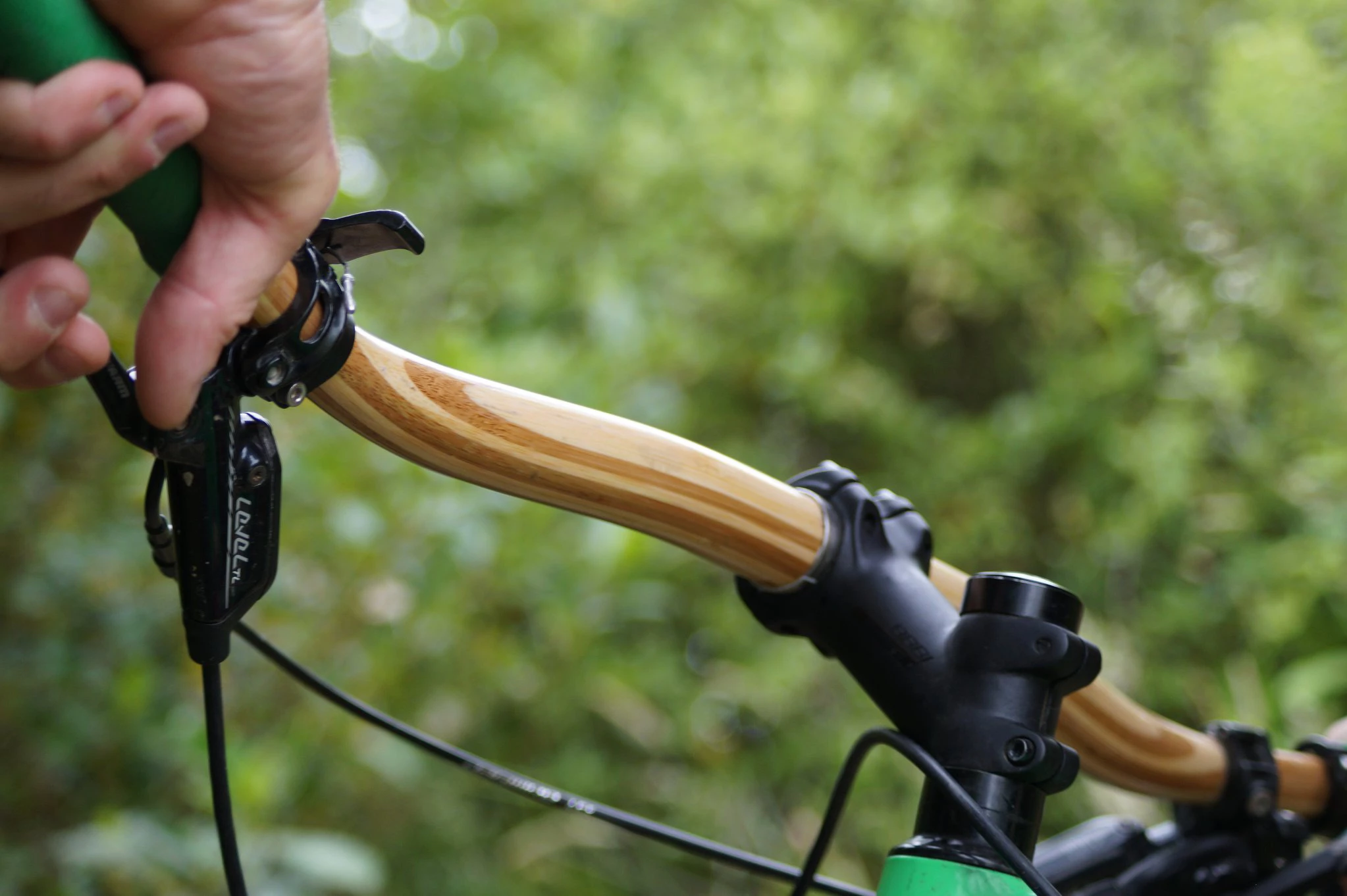 The Gump is made almost entirely of laminated layers of bamboo, with a 31.8-mm carbon fiber sleeve around the middle where it joins the handlebar stem