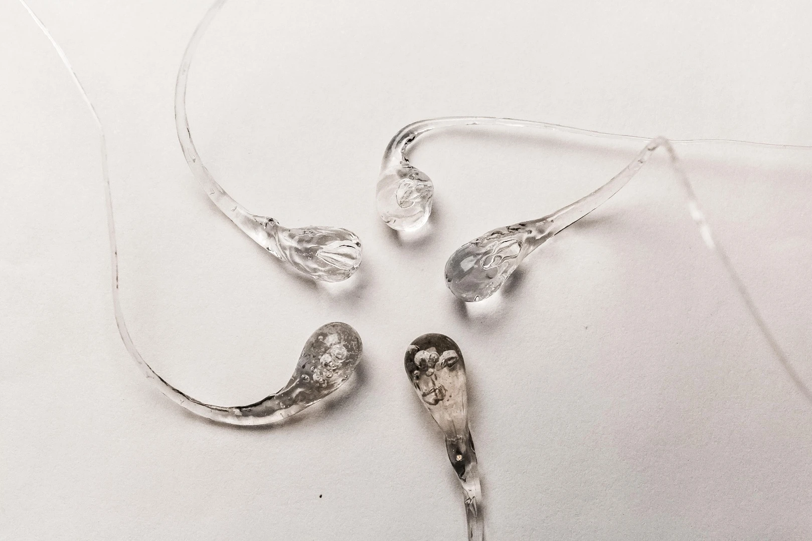 Prince Rupert’s drops, glass structures resembling tadpoles, can withstand the blows of a hammer and yet burst into powdery dust when their threadlike tails are snipped