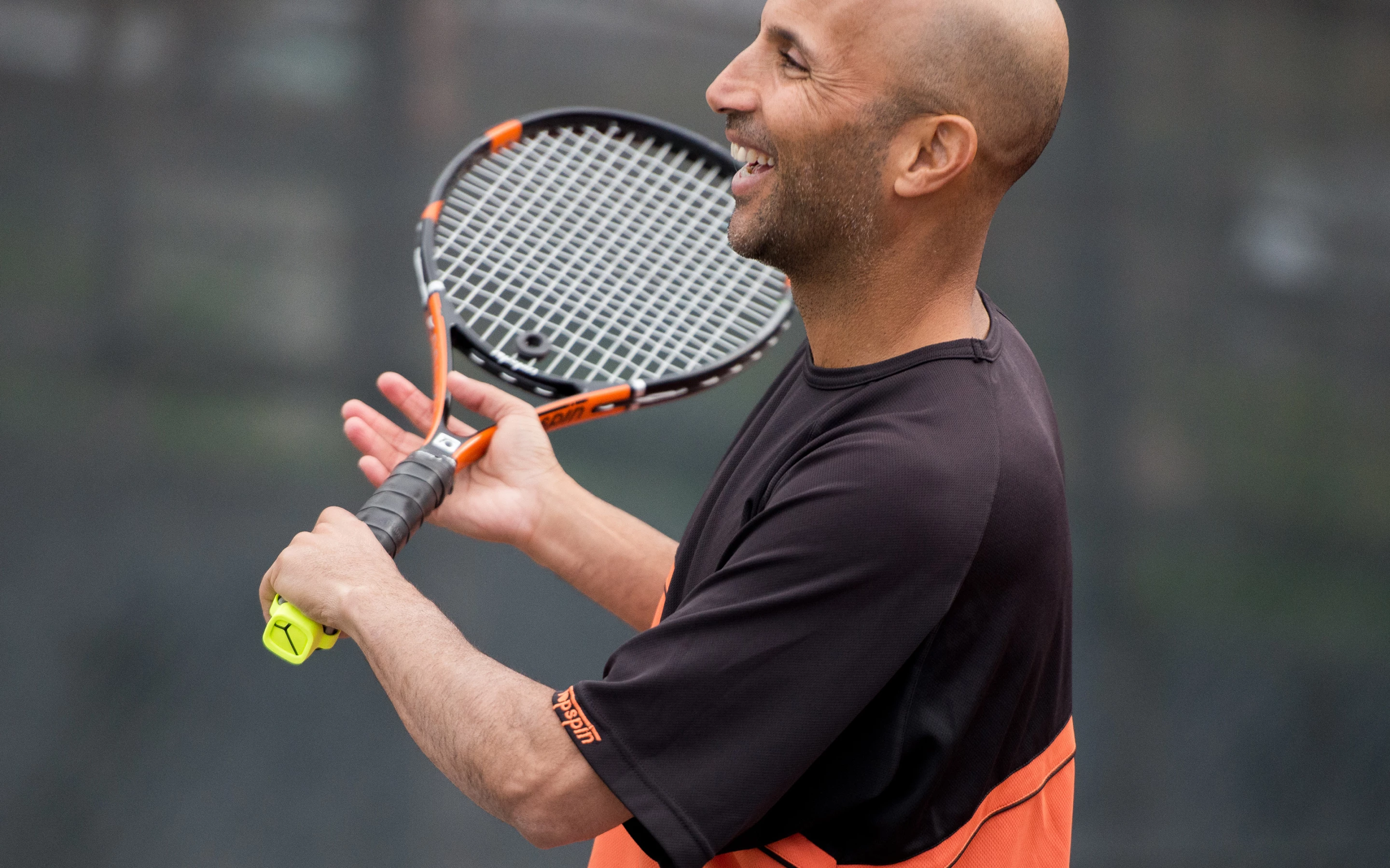 The Zepp Tennis sensor attaches to the racket handle