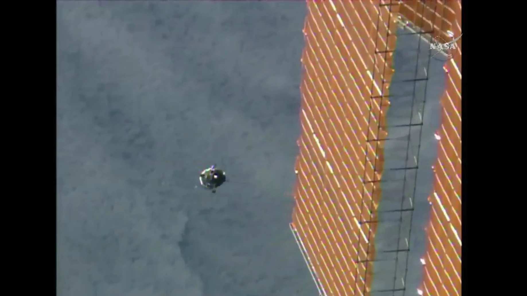 Here the Soyuz TMA-17M is seen during its final approach to the ISS – also in shot is one of the enormous solar panels that powers the orbital lab