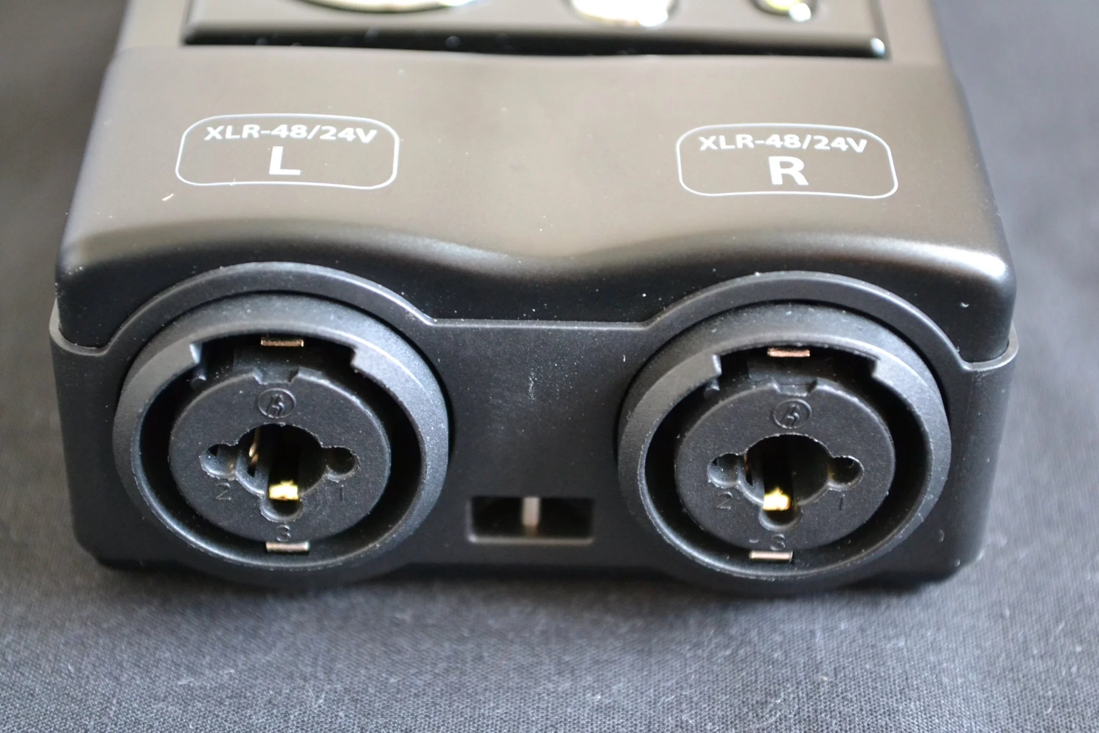 There are two XLR/Phone combo inputs on the bottom, which can provide 48/24-volts of phantom power to run either dynamic or condenser microphones or other devices