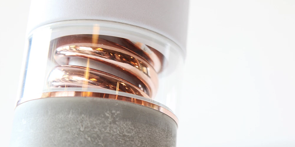 The copper spiral that rises from the concrete base was inspired by the curves of brass instruments