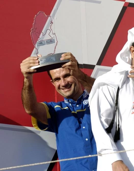 Davide Brivio takes the teams prize at Losail for the Gauloises Yamaha Team