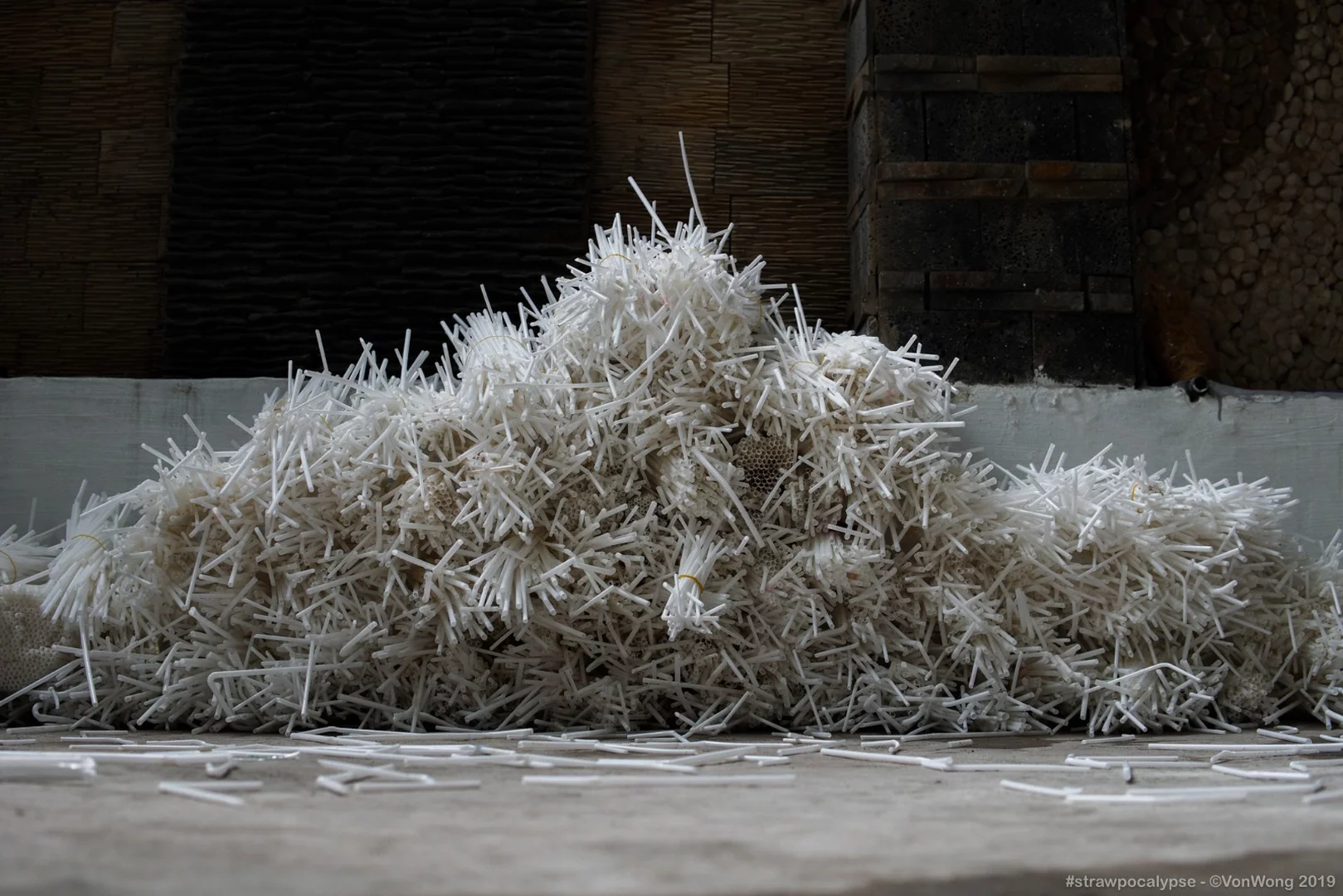 Organized plastic straws during construction of the Strawpocalypse installation