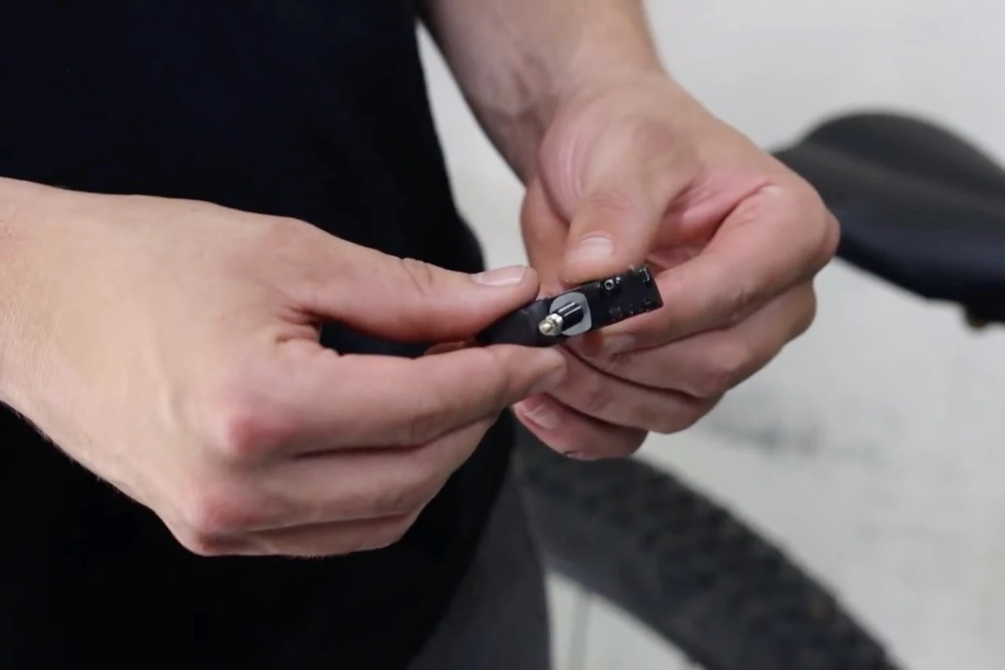 The wheel's existing valve stem is inserted through the Outrider