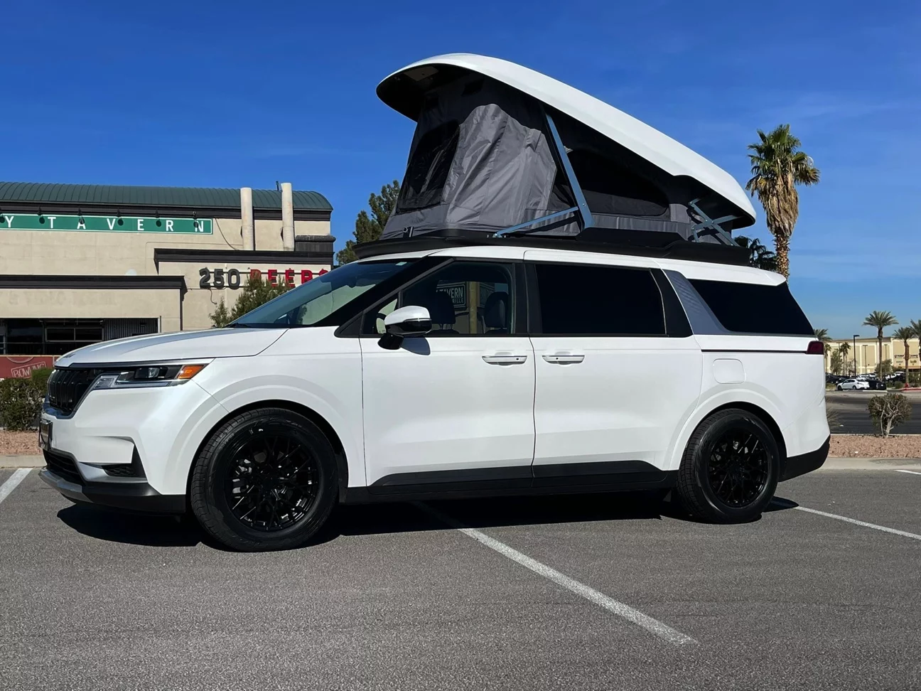 The Unicamp pop-up roof adds double-occupancy sleeping quarters to the versatile, family-moving Kia Carnival