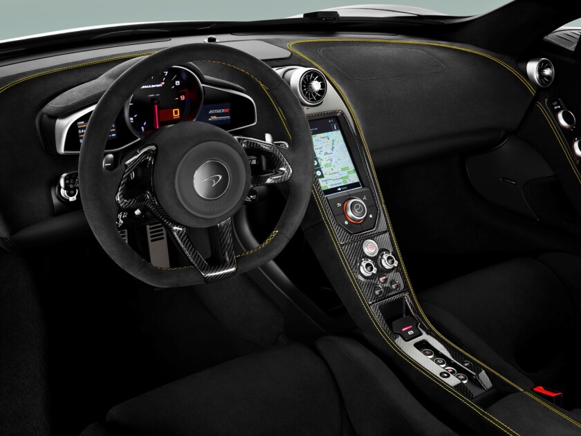 The 650S interior is replete with carbon fiber accents, an IRIS sat-nav system with Bluetooth telephony, a DAB digital radio, wireless tethering and optional P1 inspired fixed-back carbon racing seats if you like