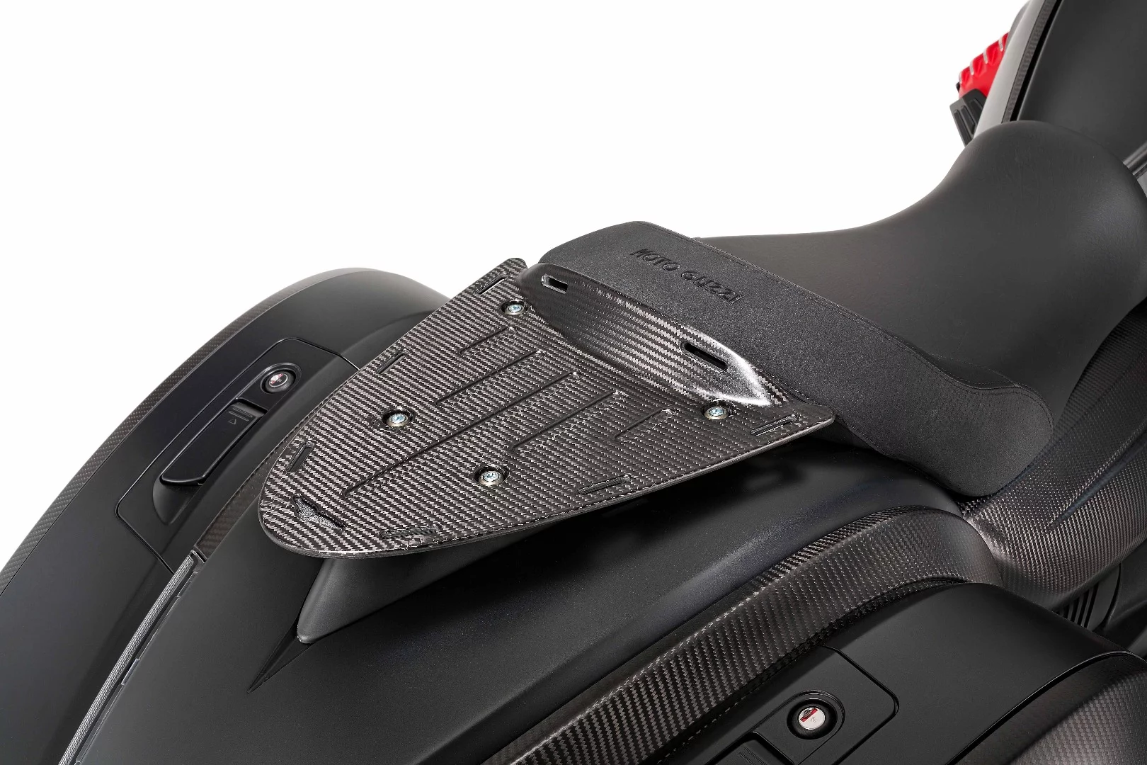 A carbon fiber luggage rack is designed to support the available top bag