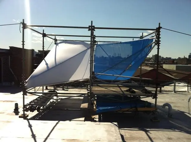 A smaller, Wendy-like demonstration on a nearby rooftop