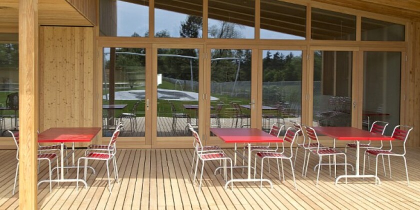 An on-site cafe offers refreshments and snacks, with wooden decking and grass providing a place for some time out (Photo: Helen Schneider)
