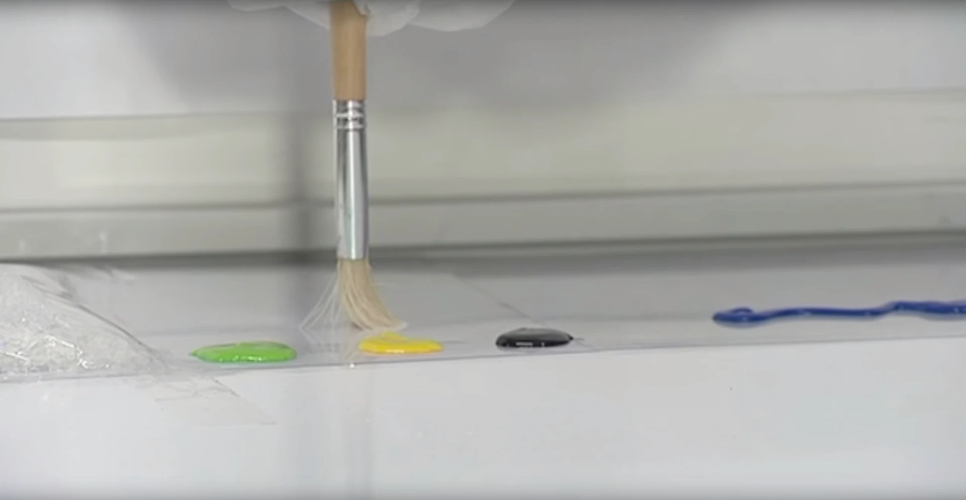To change colors, the subject blinks three times which sees the tip of the brush poised over three different options, from where they simply look at the color they want