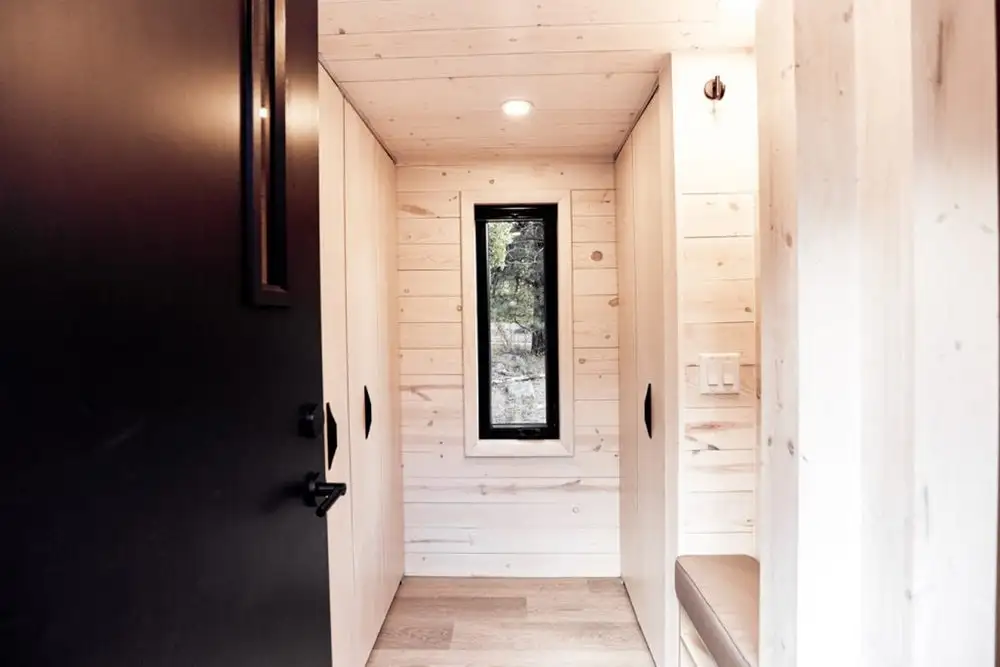 The Draper's mud room includes a large 7 ft (2 m)-wide closet, bench, storage for shoes and the like, as well as a washer/dryer combo unit