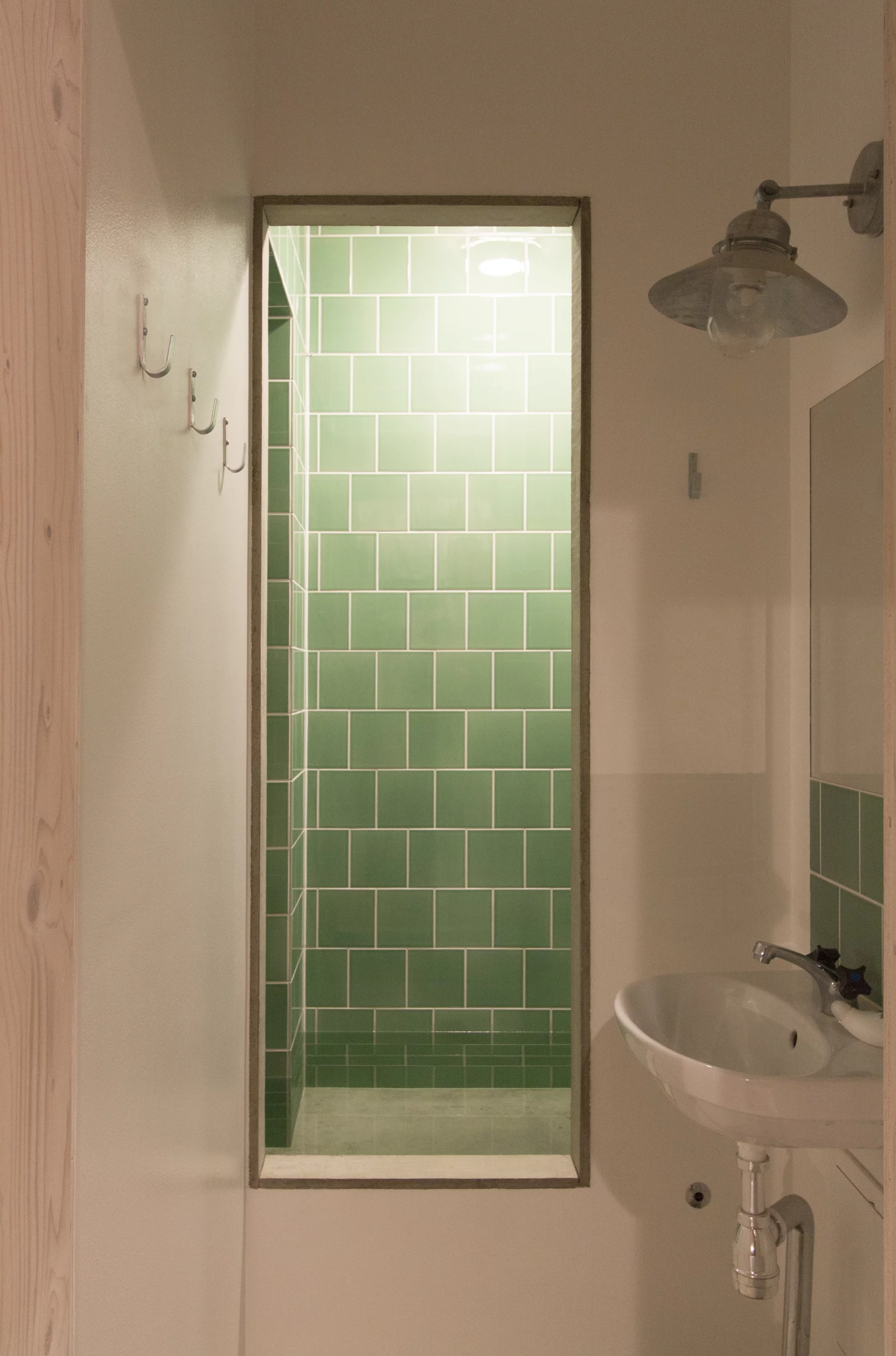 The bathroom sits adjacent to the living room