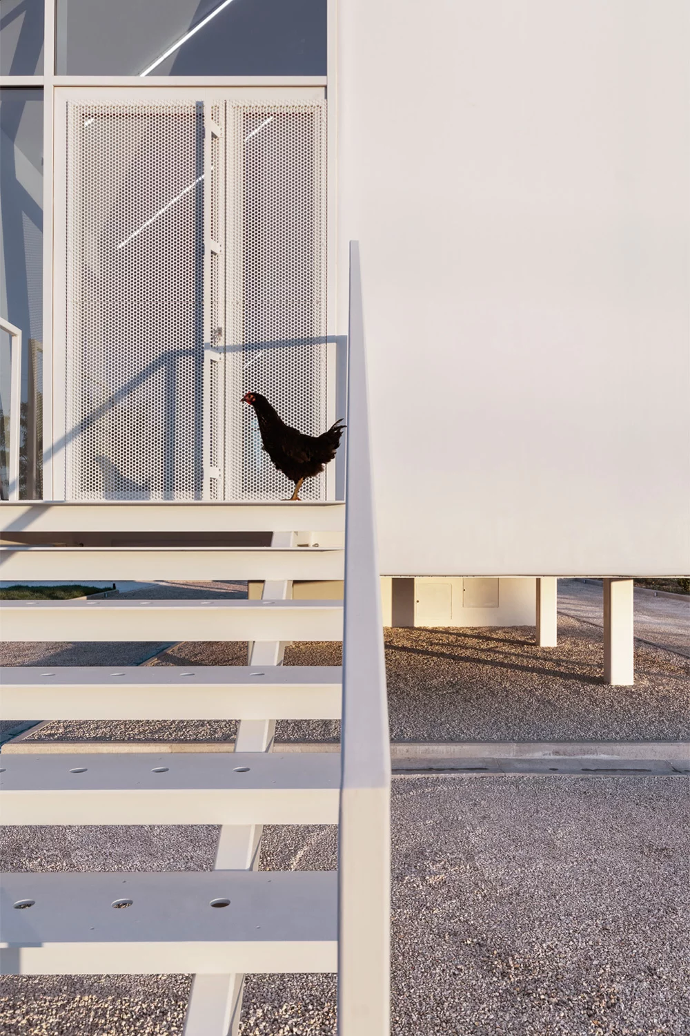A second steel staircases is located at the rear of the home