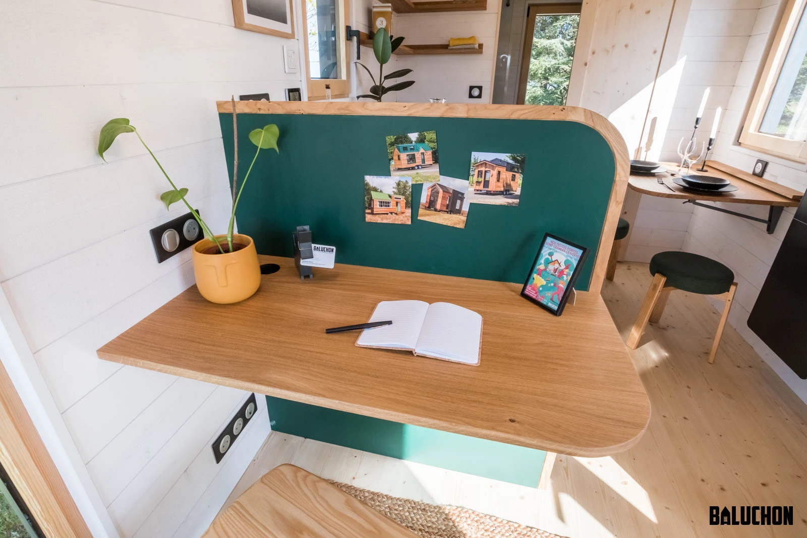 The Midgard's living room includes a small study/work area