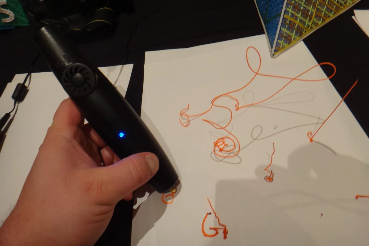 During CES 2014, Gizmag had the chance to try out the 3Doodler, a "3D drawing pen" that uses plastic filament instead of ink to sketch inventive objects