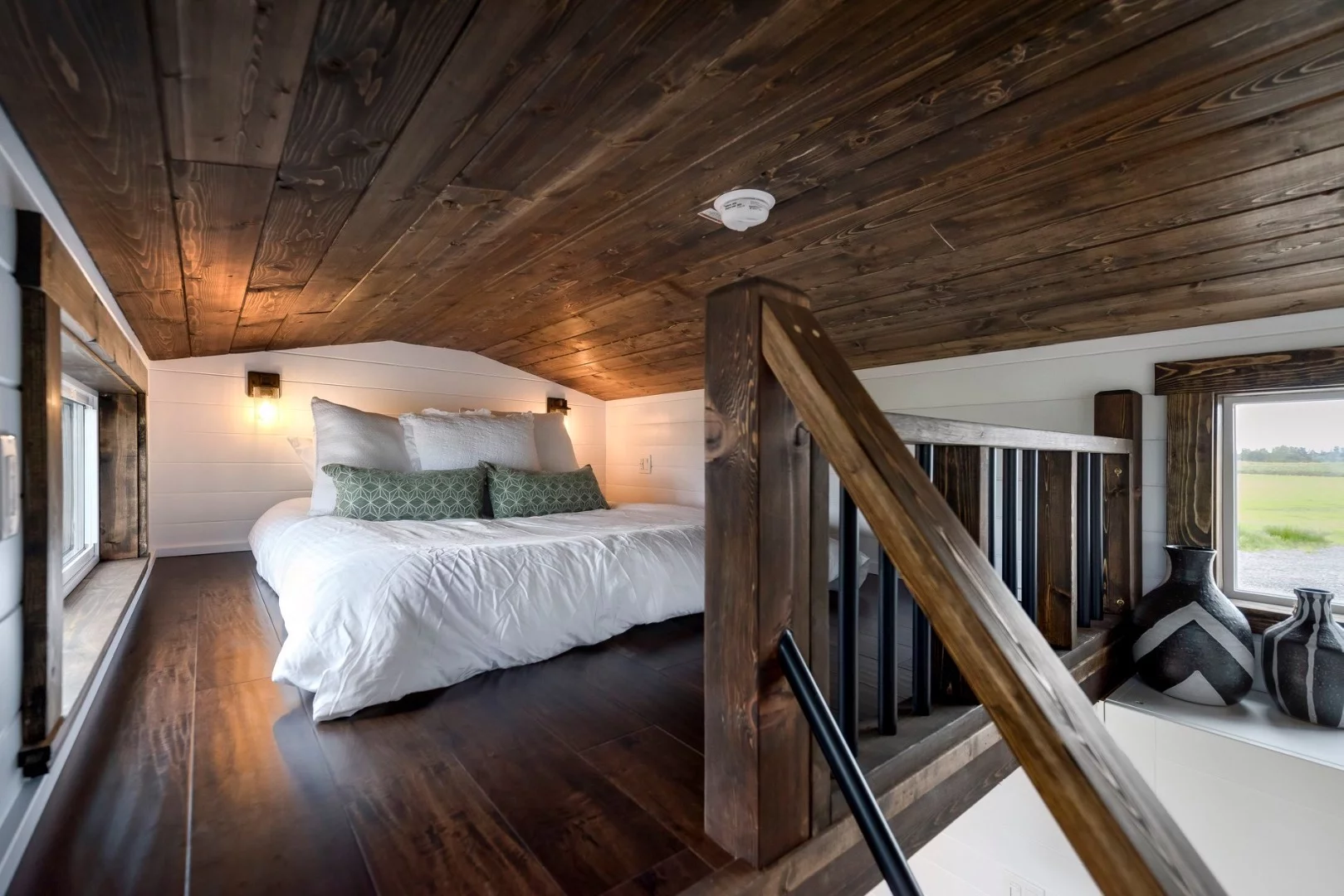The Canada Goose's loft bedroom is a typical tiny house style bedroom with a low ceiling