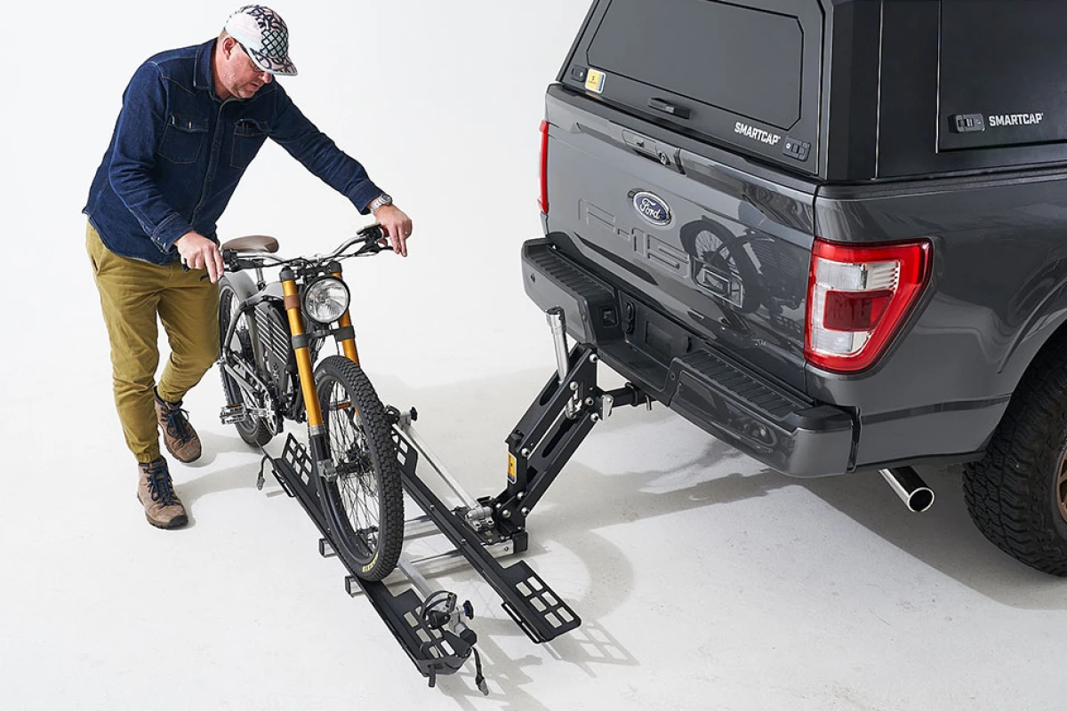 Users can roll eMTBs or electric motorbikes on and off of the Bike Lifter tray