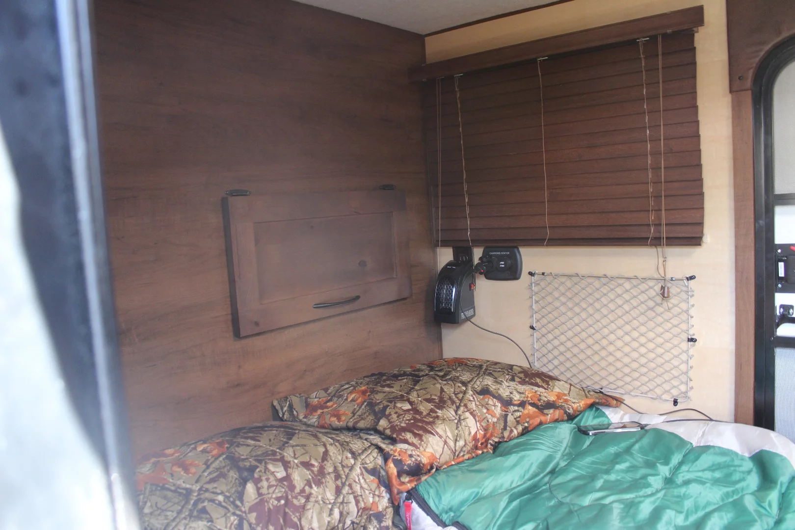 We'd imagine those blinds on the Vanguard Jeger trailer get annoying after a few trips of bouncing down bumpy roads and being pulled up and down at camp, but they look nice on the show model