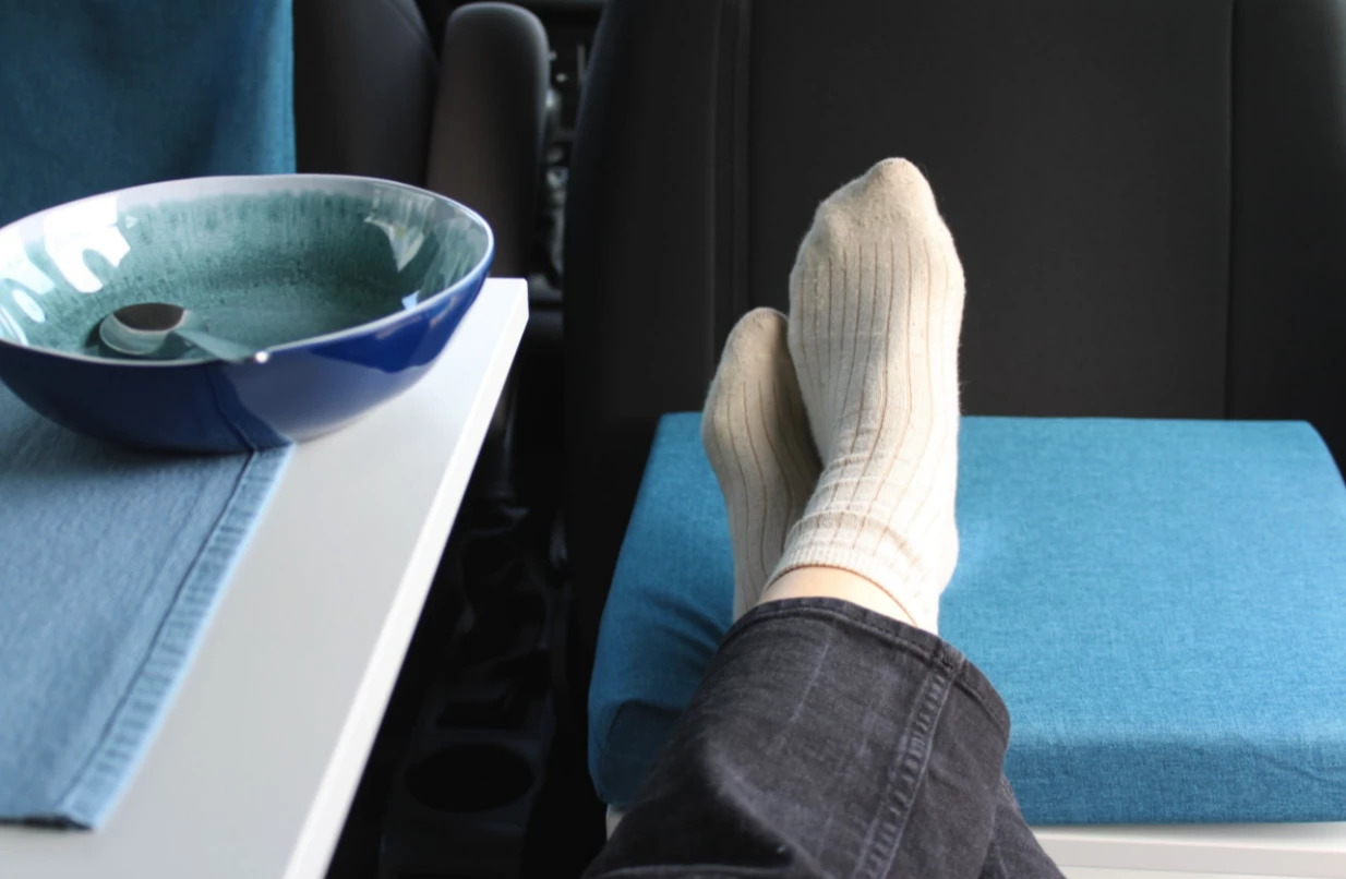 The third seat also works as an ottoman or outdoor table