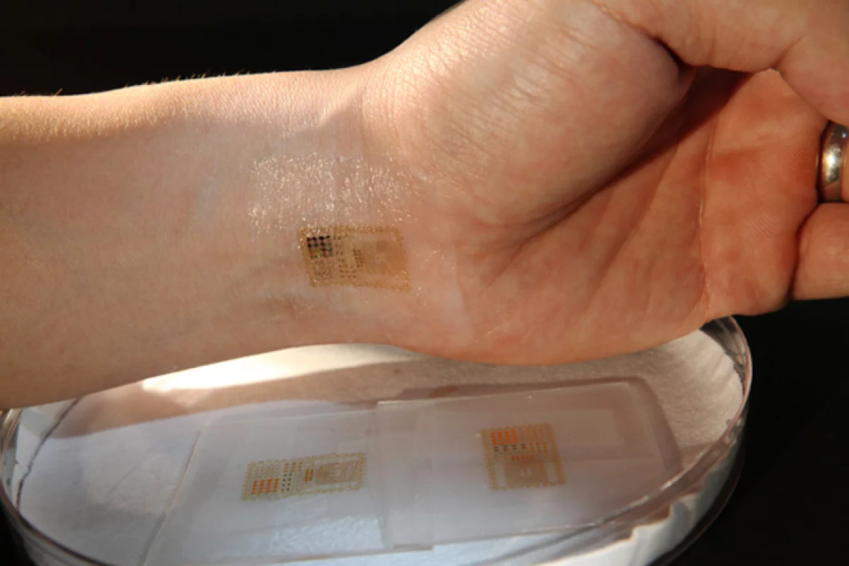 An ultrathin, electronic patch with the mechanics of skin, applied to the wrist for EMG and other measurements (Image: John Rogers)