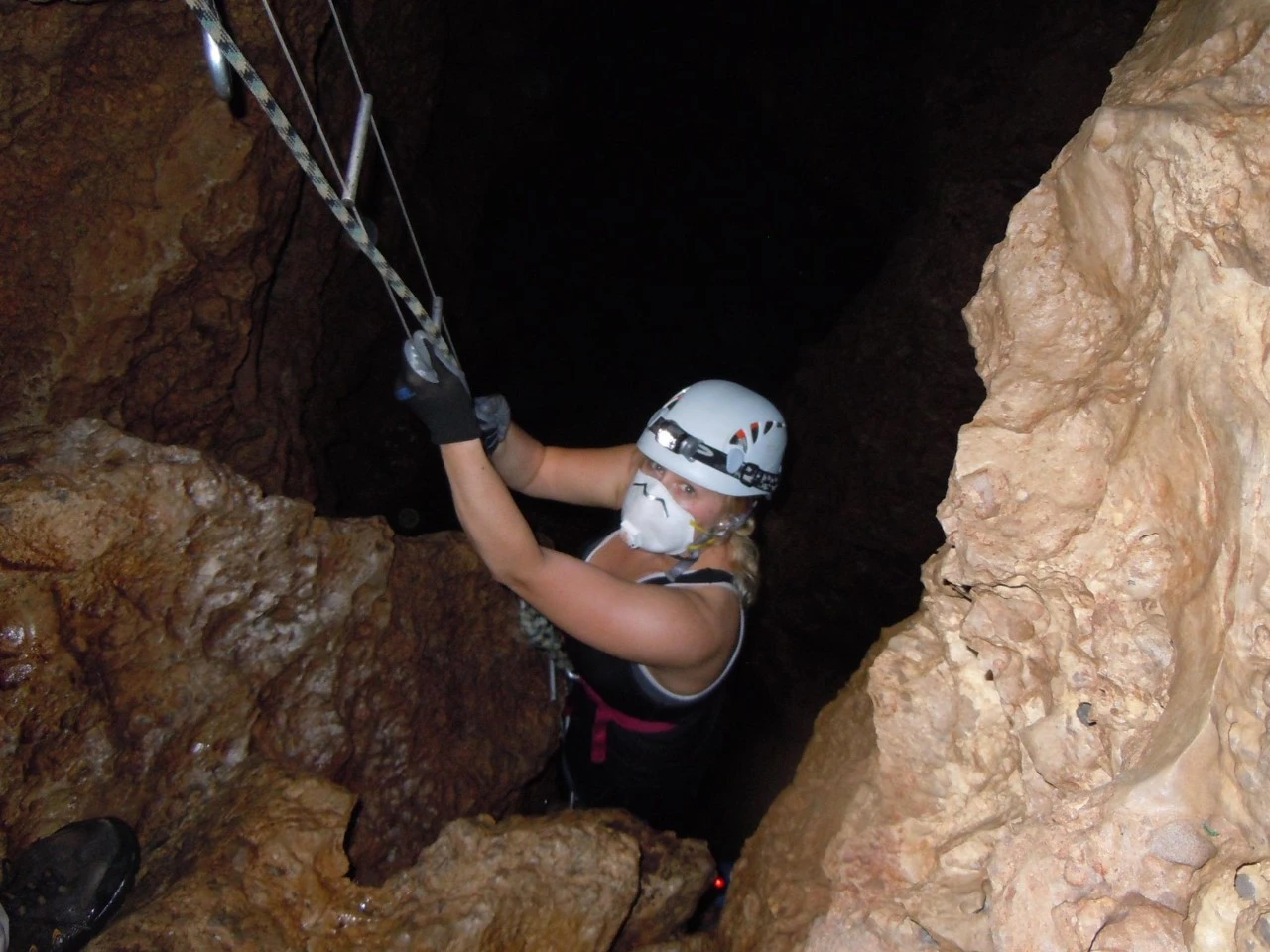 Researcher Amanda Powers descending into a cave in Mexico to look for blind cavefish