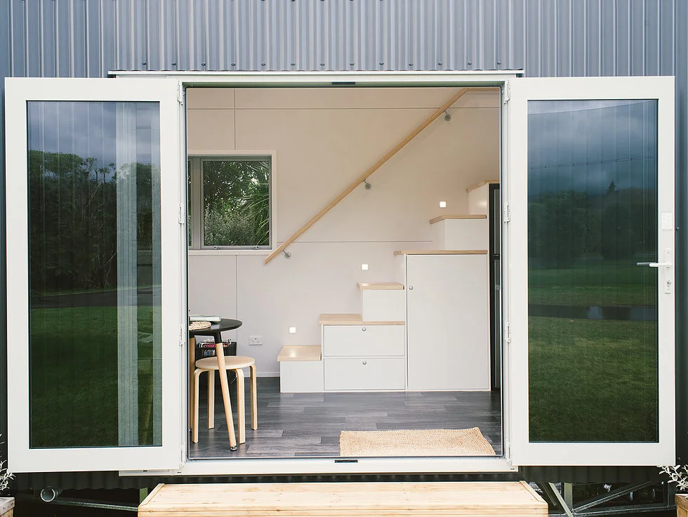 The Buster Tiny House opens up to the outside with large double doors