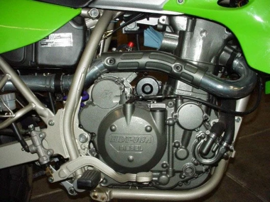 The engine configuration is a liquid cooled, normally aspirated, 584cc (36 cu in) double overhead cam single with four valves per cylinder.