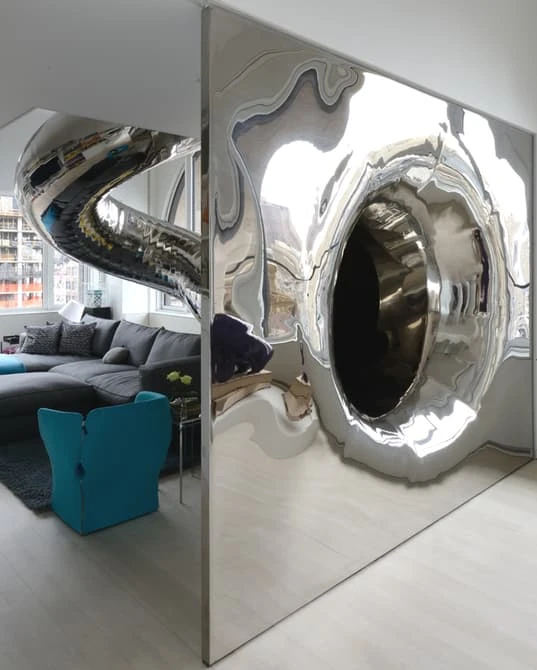 You can then either leave the slide or continue the journey down to the bottom, ending up in the home's entrance gallery