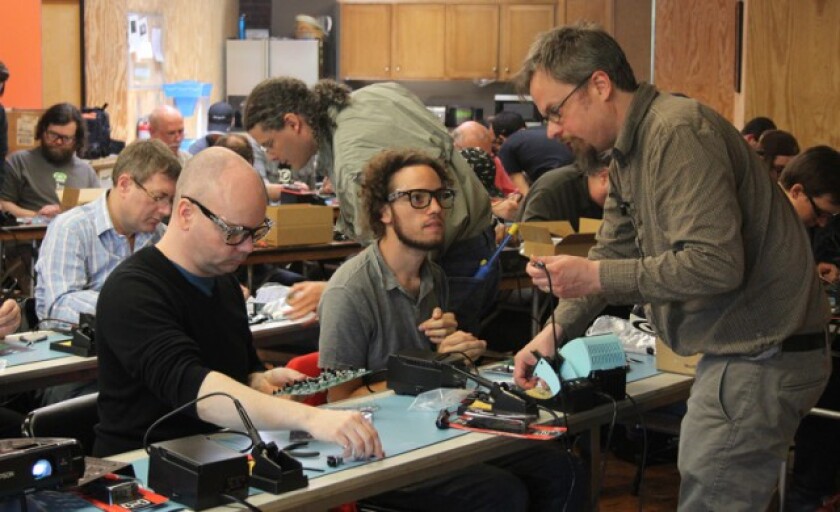 Particpants learn to build the Werkstatt-Ø1 at the Moogfest 2014 Engineering VIP Workshop