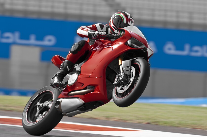 Troy Bayliss on Ducati's newest superbike. A generation of two of big V-twins down the track, and we may be referring to Indian-produced Ducatis.
