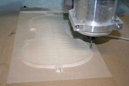 Photograph of the CNC machine carving the back of the Stradivari Betts violin reproduction. (Photo: RSNA)
