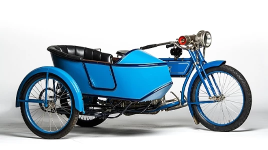 Produced from 1911 to 1917, when it became part of the Schwinn empire, the two-speed Model D long-wheelbase (65 inch) 1915 Henderson Four cost $335 and although Henderson offered a sidecar option at the time, the motorcycle on offer here is a Rogers item. Other features of note on this machine include an aftermarket passenger saddle, full acetylene lighting set, and a Klaxon horn. This 1915 Henderson Model D With Rogers Sidecar (Lot S80) is estimated to fetch between $250,000 and $300,000