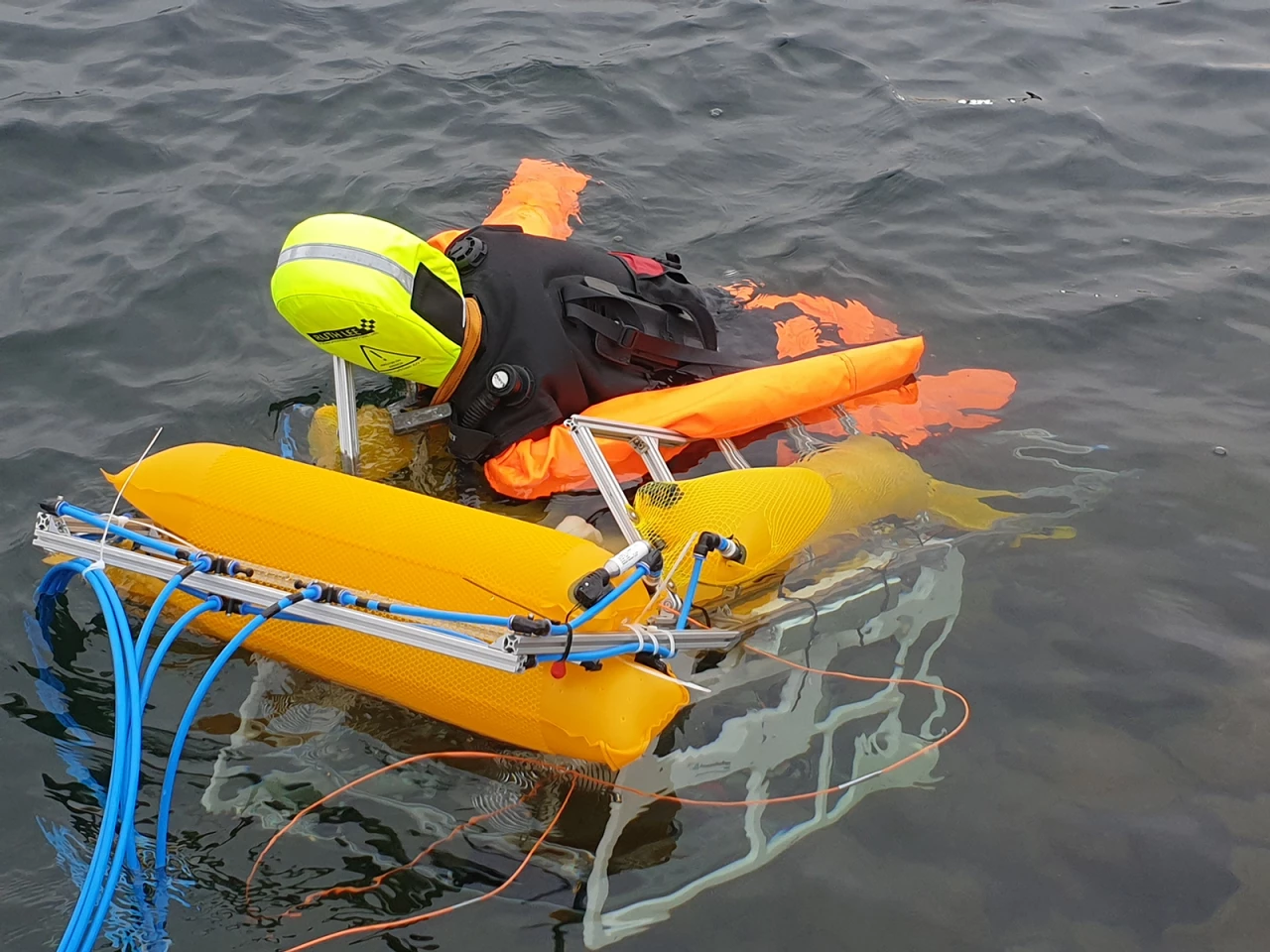The robot transports the dummy to shore