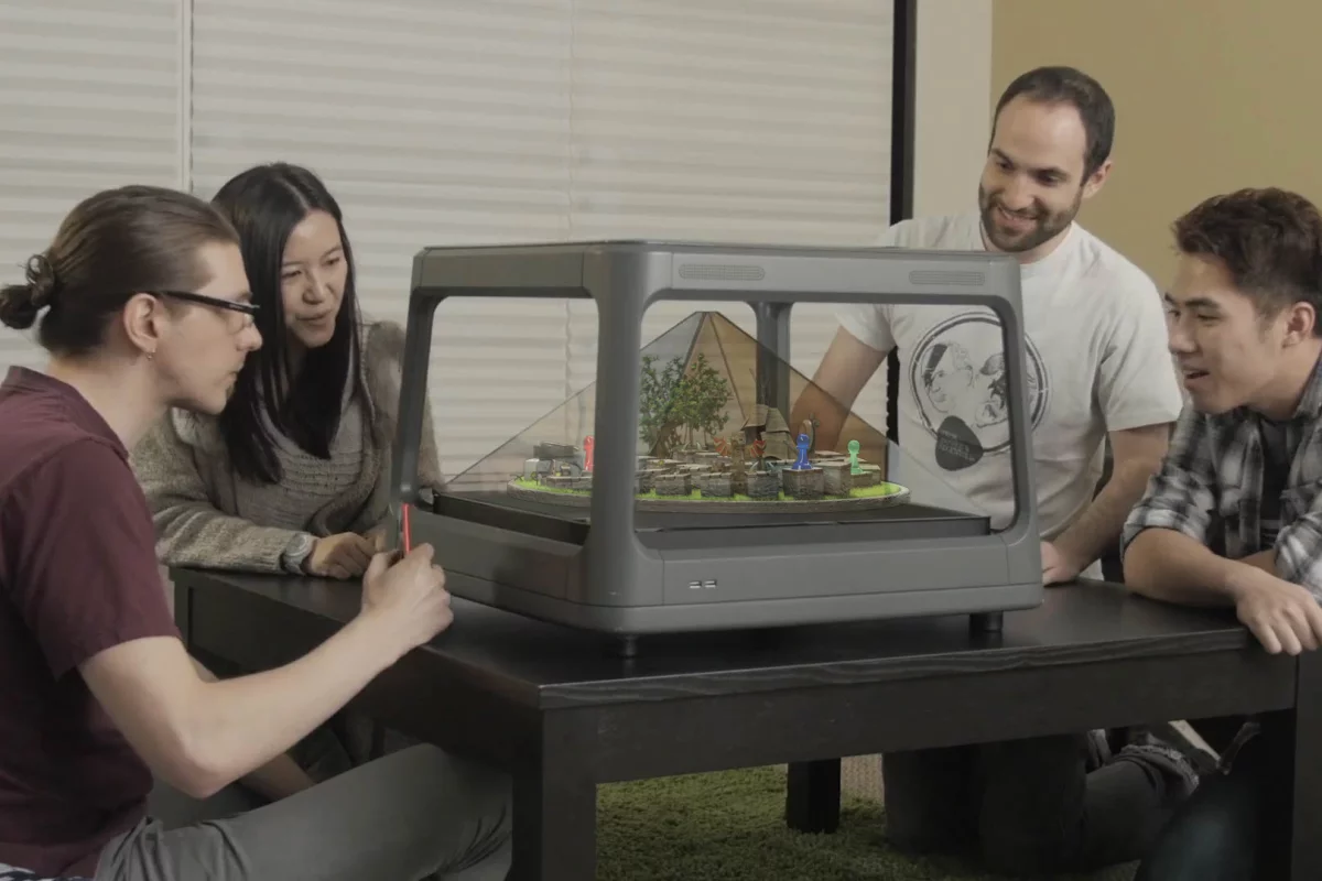 Holus projects 2D images onto the surfaces of a pyramid to produce the illusion of three-dimensional objects and worlds that you can interact with and look at from multiple angles